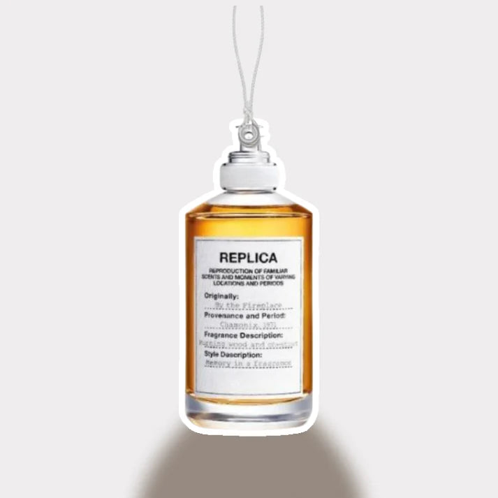 Replica perfume bottle with label on a white background