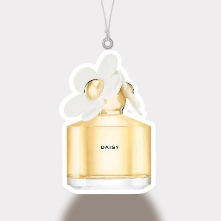 DAISY perfume bottle with white flower design on a light gray background